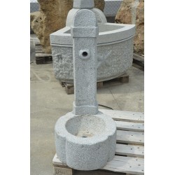 Fountain in granite column