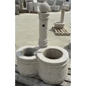 Fountain in granite column